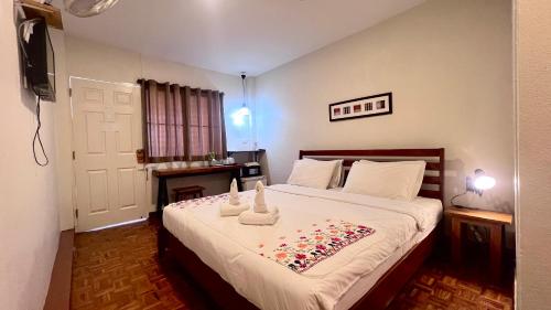 Postel nebo postele na pokoji v ubytování UDEE Cozy Hotel