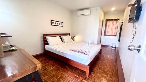 Postel nebo postele na pokoji v ubytování UDEE Cozy Hotel