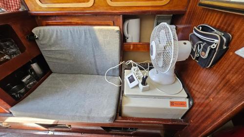 a fan sitting in the back of a boat at Lisbon Romantic Boat Expo in Lisbon