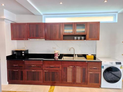 Η κουζίνα ή μικρή κουζίνα στο Blue Haven Bay Villa 21C