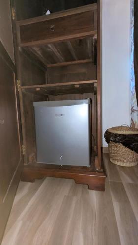 a flat screen tv sitting in a entertainment center at Sea Turtles Bungalow in Induruwa
