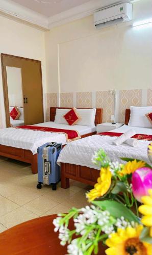 Postel nebo postele na pokoji v ubytování Tân Tuấn Tuấn Hotel
