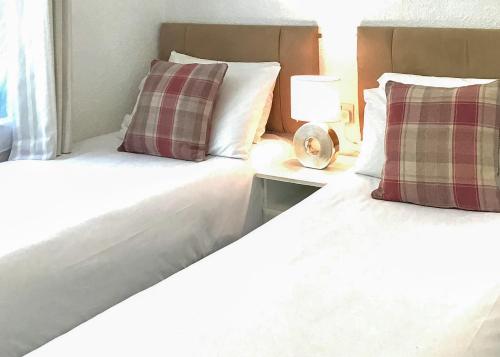 Ένα ή περισσότερα κρεβάτια σε δωμάτιο στο Paradise Lakeside Lodges
