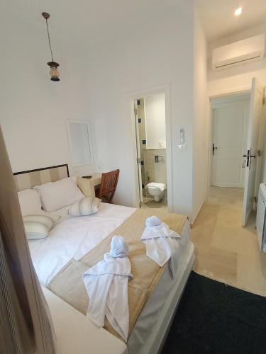 Katil atau katil-katil dalam bilik di Hôtel Al Jazira Mahdia