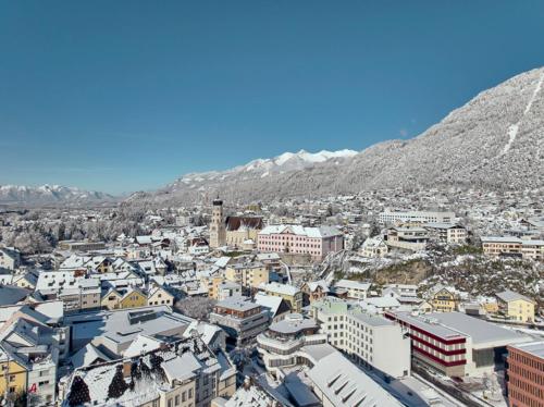 an aerial view of a city with mountains in the background at Bella Vista Ferienwohnung in Bürs