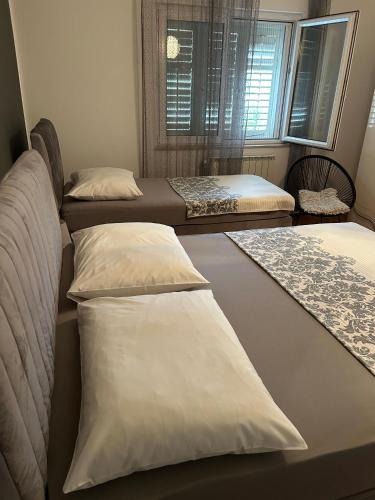 Postel nebo postele na pokoji v ubytování Apartment Viki