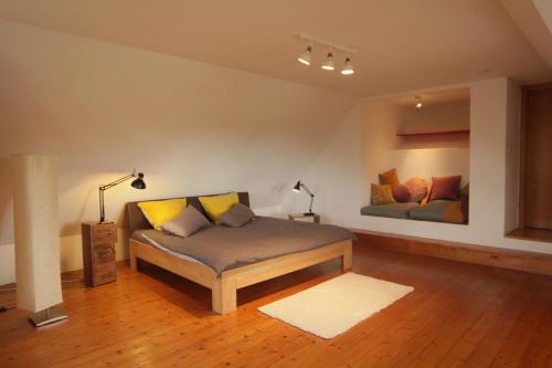a living room with a couch and two beds at Schönes Haus in Tüttendorf