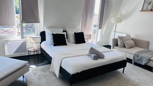 Una cama o camas en una habitación de Appartement Cosy - Proche Roissy, Disney et Gare pour Paris