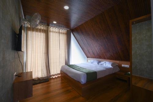 Katil atau katil-katil dalam bilik di Heaven-Vadanapilly Beach Villa
