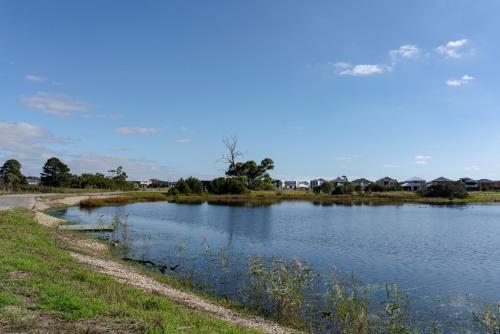 a body of water with a road next to it at Haven Lakeside Berwick in Berwick