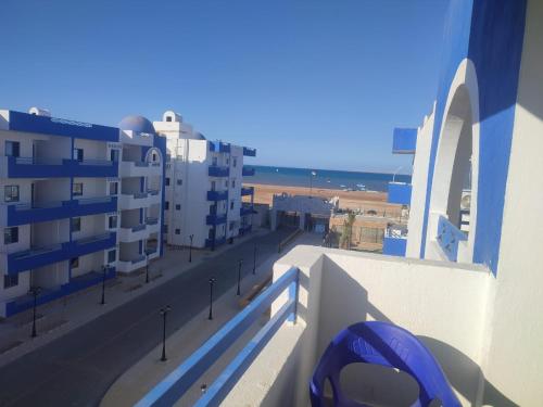 a view of a street from a balcony with buildings at Luxuries Studios and apartments in Oasis Marina ,Hurghada in Hurghada