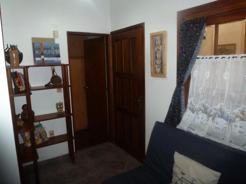 a room with a door and a window and a shelf at Montelife in Montevideo