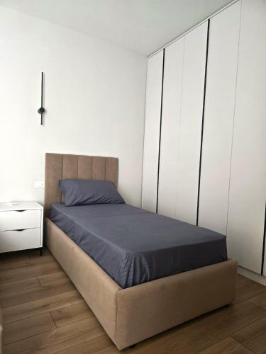 a bedroom with a bed and a dresser at Poolside Bliss - Escape & Relax in Kalmet