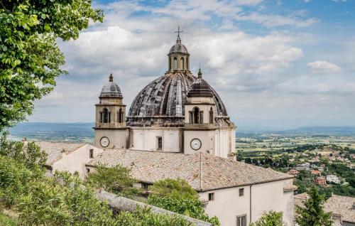 a building with a clock tower on top of a building at Amazing Home In Montefiascone in Montefiascone
