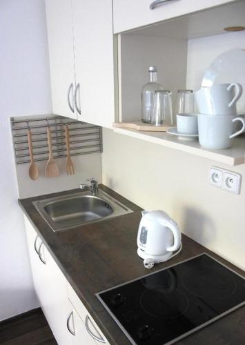 a kitchen with a sink and a toaster on the counter at Jannete in Jundrov