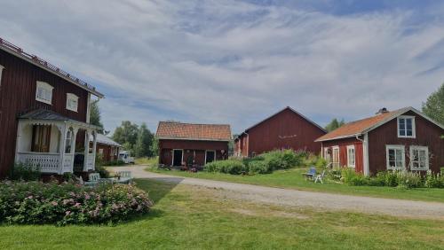 a group of barns and houses on a dirt road at Solberg Inn 