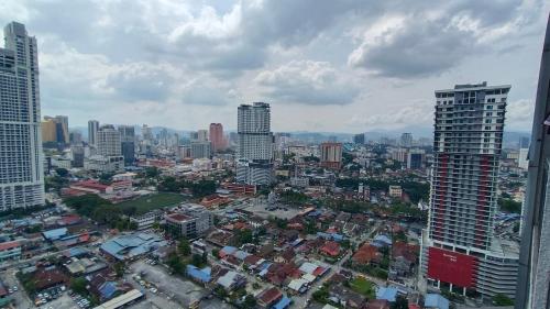 a view of a city with tall buildings at Summer Suites KLCC by CozyNest in Kuala Lumpur