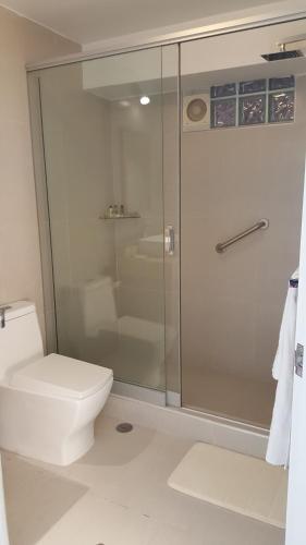 a bathroom with a shower and a toilet at Wayqey Hotel in Cusco