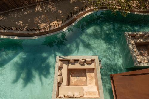 an overhead view of a swimming pool at AWA Holbox Hotel Boutique - Beach Front in Holbox Island