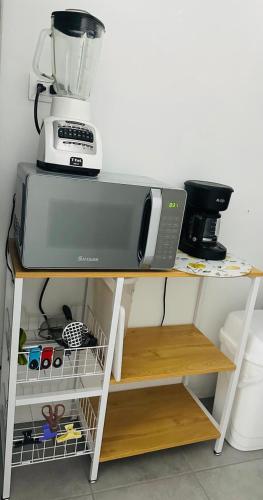 a counter with a blender on top of it at Comfortable house in Zaragoza