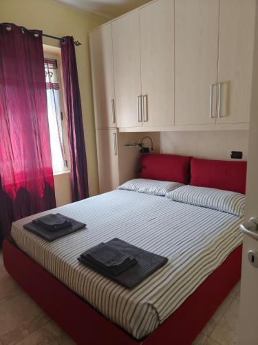 a bedroom with a bed with towels on it at La casa di Betta in Lerici