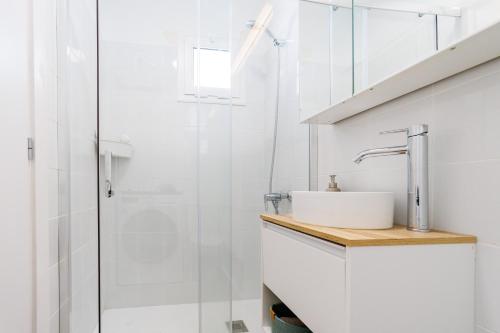 a bathroom with a sink and a shower at Guanabara Sunset in Puerto Rico de Gran Canaria