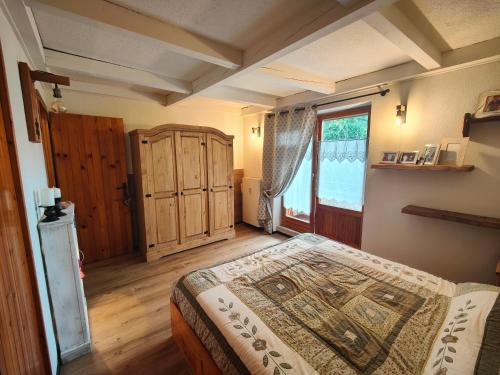 a bedroom with a large bed and a window at Alpina Loft in Sauze d'Oulx in Sauze dʼOulx