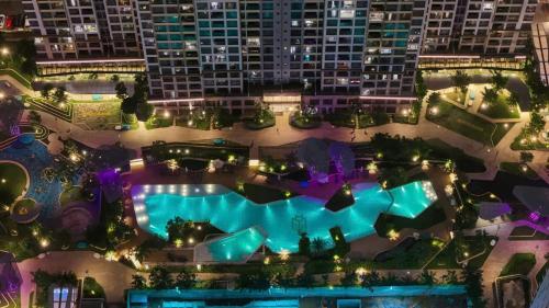 an aerial view of a pool at night at Shi House - Studios S601 Origami Cozy Comfortable in Long Bình