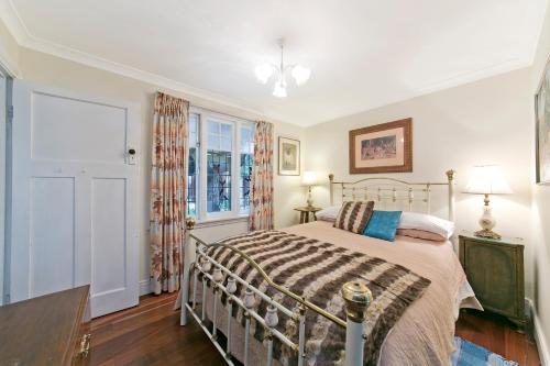 a bedroom with a bed and a window at Hillside Country Retreat in York