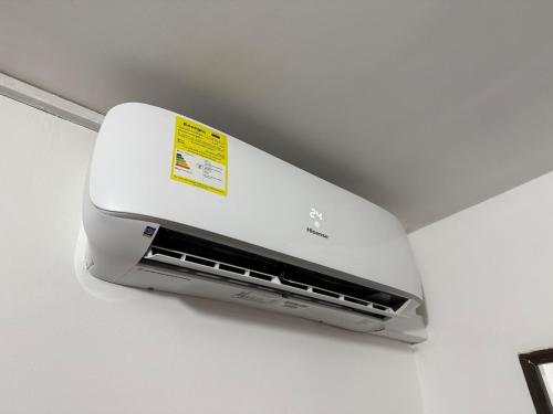 a white air conditioner hanging from a ceiling at Loft Boutique Rooftop I Gym I Laureles I MedView in Medellín