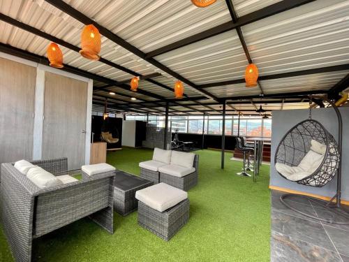 a room with couches and chairs and a table at Loft Boutique Rooftop I Gym I Laureles I MedView in Medellín