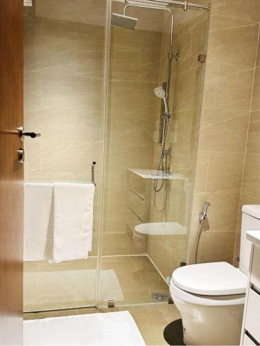a bathroom with a shower and a toilet at YAKA Trizen Luxury Apartments - 53rd and 51st Floor with Stunning Views in Colombo