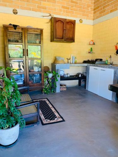 a kitchen with a sink and a refrigerator at Ashok villa in Weligama