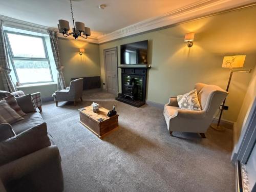 a living room with a couch and a coffee table at The Lookout in Tobermory