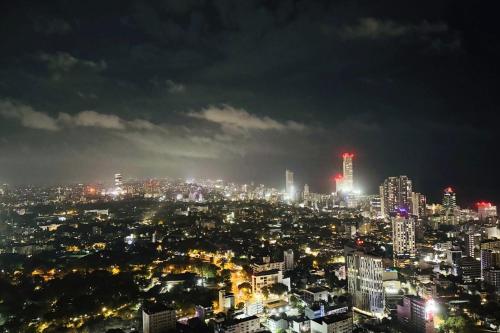 a view of a city at night at YAKA Trizen Luxury Apartments - 53rd and 51st Floor with Stunning Views in Colombo