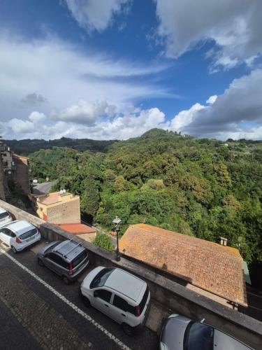 a group of cars parked in a parking lot at La Casa Dei Principi - B in Genazzano