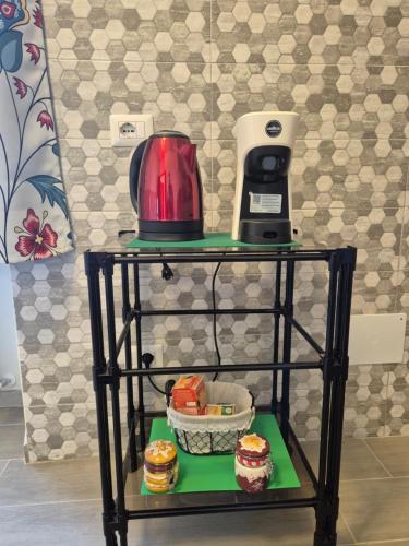 a table with a blender and some food on it at La Casa Dei Principi - B in Genazzano