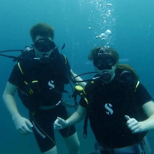 a group of three people in scuba gear in the water at Genge Lake Resort - Kalpitiya in Pallivasalturai