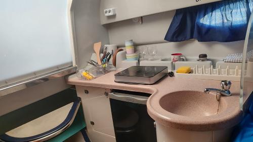 a small kitchen with a sink and a counter top at Long term Golf del Sur in San Miguel de Abona