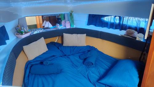 a blue bed in the back of a boat at Long term Golf del Sur in San Miguel de Abona
