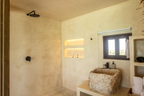 a bathroom with a sink and a window at AWA Holbox Hotel Boutique - Beach Front in Holbox Island