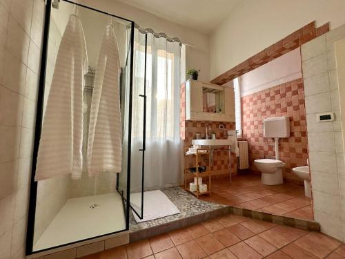 a bathroom with a shower and a toilet at House 130 Francavilla B&B in Francavilla al Mare