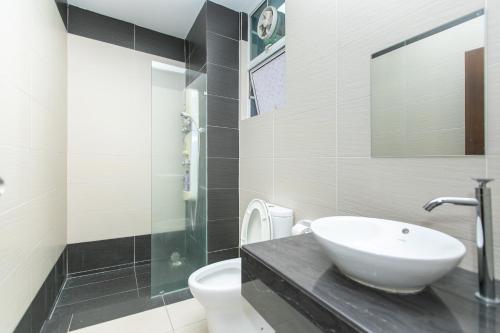a bathroom with a sink and a toilet at Tanjung Bungah Villa 20 pax Mahjong Snooker and More Close to Beach in Tanjung Bungah