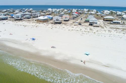 an aerial view of a beach with a group of people at Wave Loudest, Private Pool, Beach in Dauphin Island
