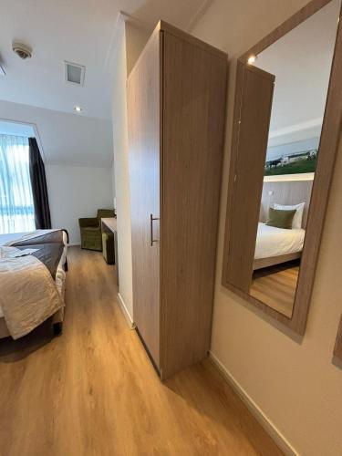 Postel nebo postele na pokoji v ubytování Hotel Herberg de Linden