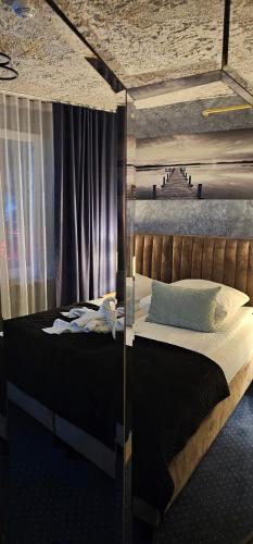 Ένα ή περισσότερα κρεβάτια σε δωμάτιο στο APARTAMENT z JACUZZI SPA