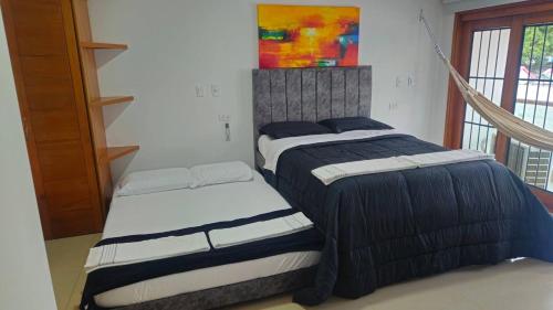 2 camas en una habitación con en Guest House with AC, close to Historical Centre 1, en Cartagena de Indias