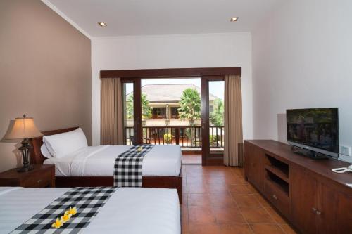 Postel nebo postele na pokoji v ubytování Vidi Boutique Hotel