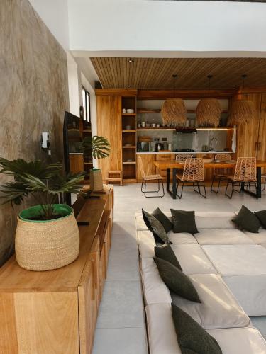 a living room with couches and a table at abode II Zanzibar in Paje