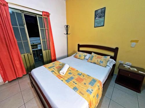 Ένα ή περισσότερα κρεβάτια σε δωμάτιο στο Hotel C Villa Plaza San Gil